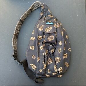 KAVU Rope Sling Bag Womens Medium Black Pinecone Print Crossbody Backpack Hiking